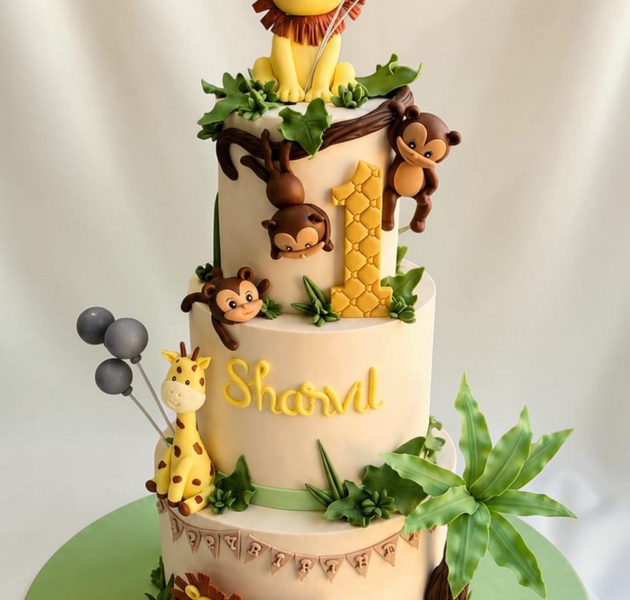 Fun and adorable 3-tier jungle safari birthday cake