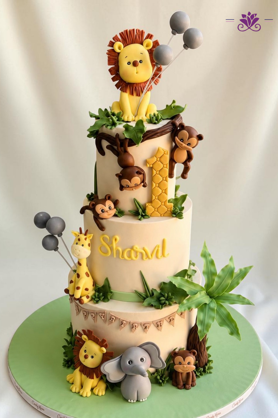 Fun and adorable 3-tier jungle safari birthday cake