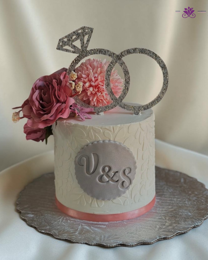 Elegant pink and white floral anniversary cake