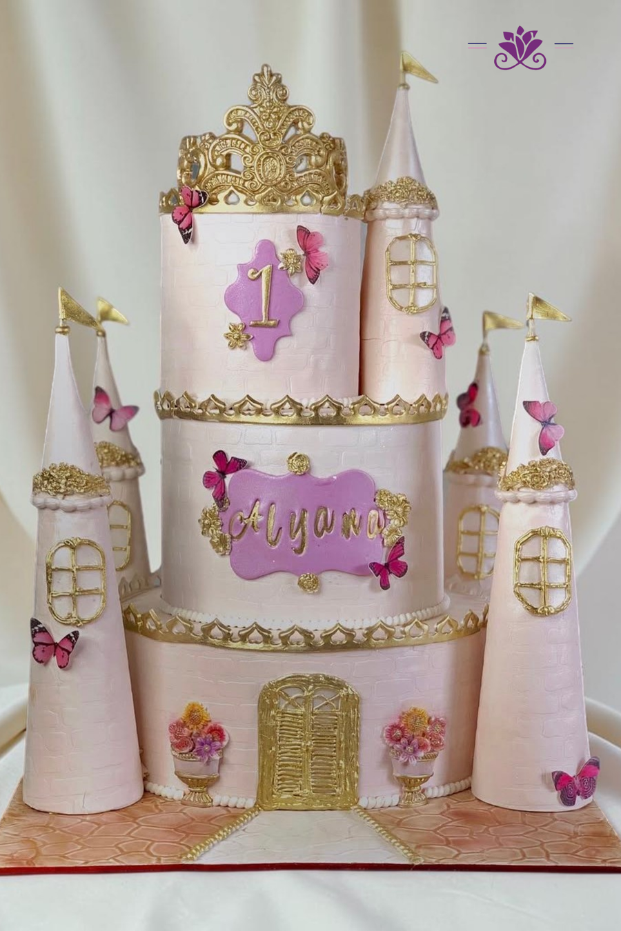 Magical pink and gold princess castle cake