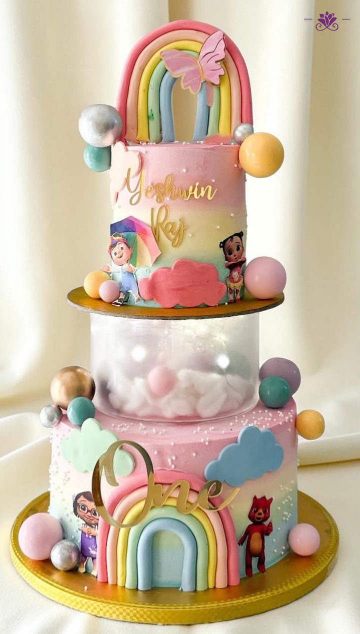 Rainbow Cartoon 1st Birthday Cake with Transparent Surprise Tier & Pastel Design (Eggless Designer Cake)