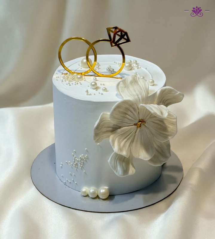 Luxury Engagement Cake with Ring Topper, Pearl Detailing & Elegant Floral Design (Eggless Designer Cake)