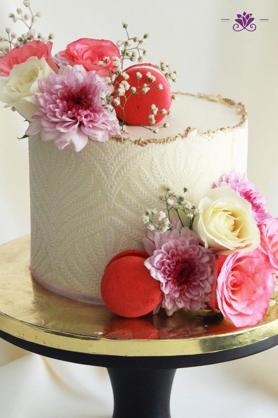 Elegant subtle gold-edged finish. pink and white floral cake