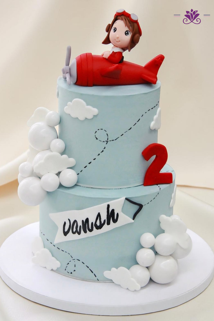 Blue airplane-themed birthday cake
