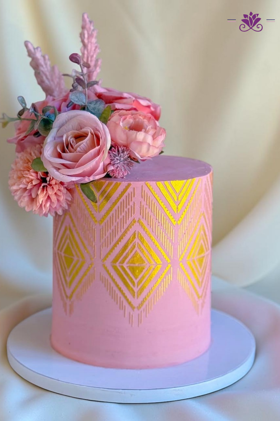 Elegant pink and gold floral cake