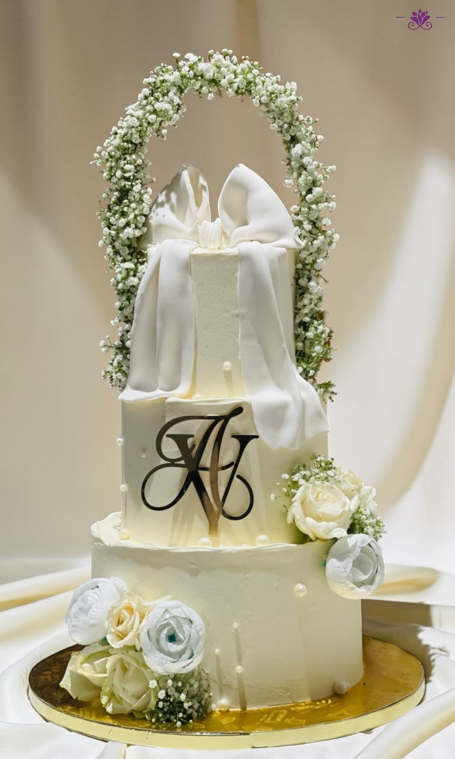 Elegant White Floral Bow Wedding Cake