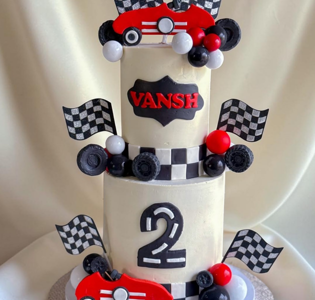 Stylish two-tier racing car birthday cake