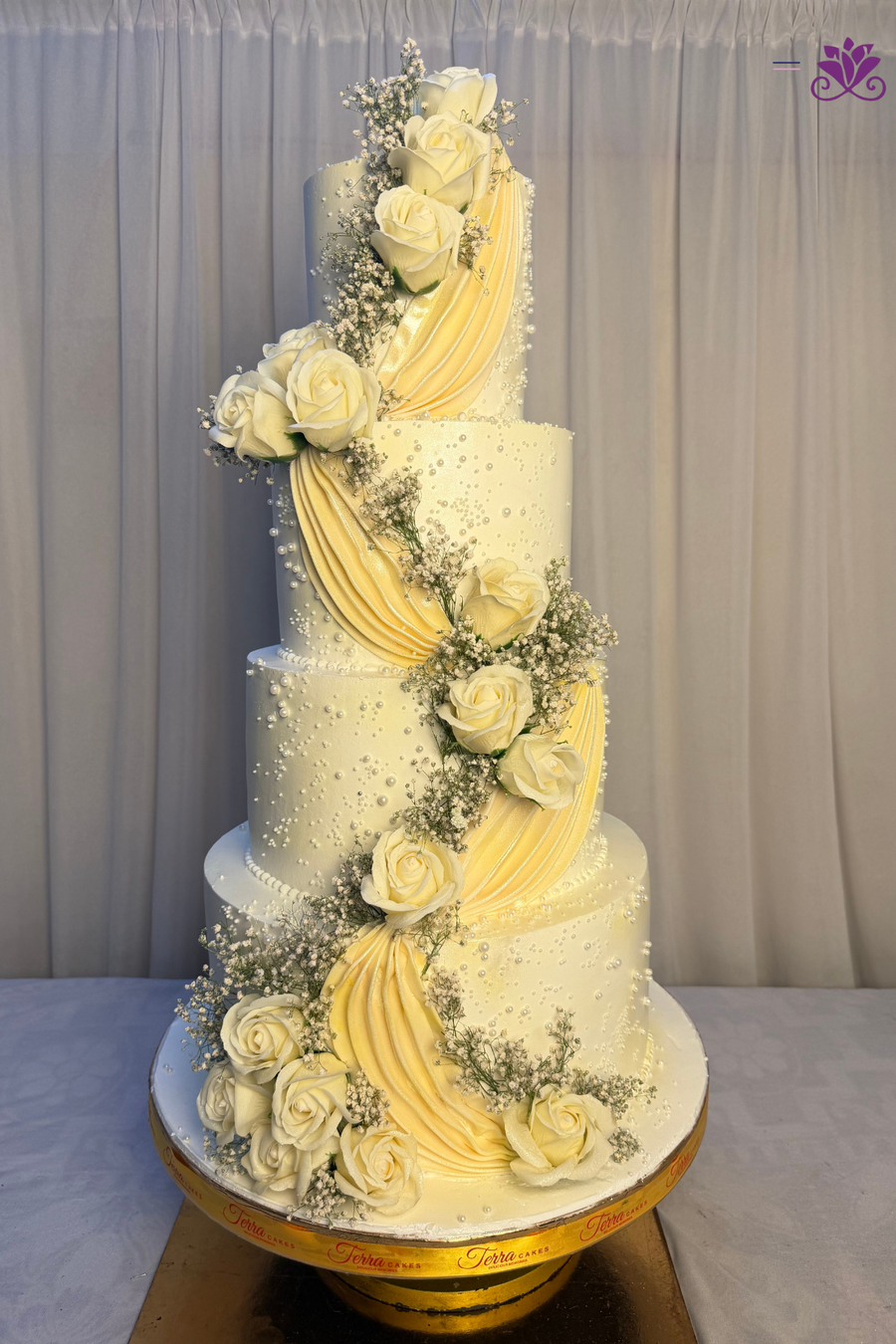 Grand 4-Tier Ivory & Buttercream Swag Cascading Rose Wedding Cake